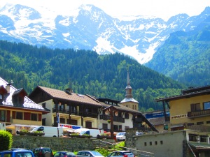 The center of town with the majestic, snow-peaked Alps rising in the background,